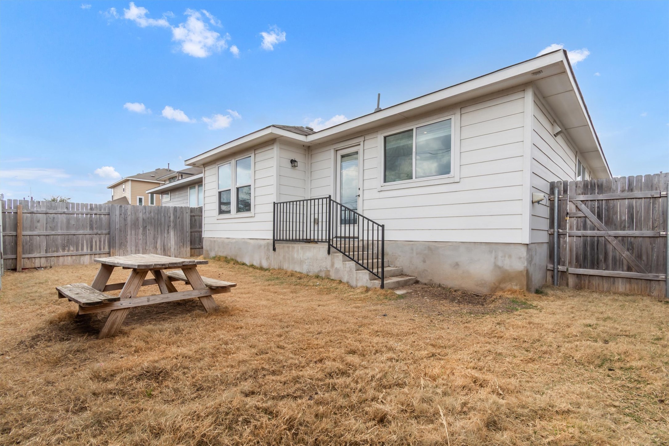 460 Delta Crest Maxwell, TX 78656 - Photo 17 of 18 Rear view of property featuring a fenced backyard