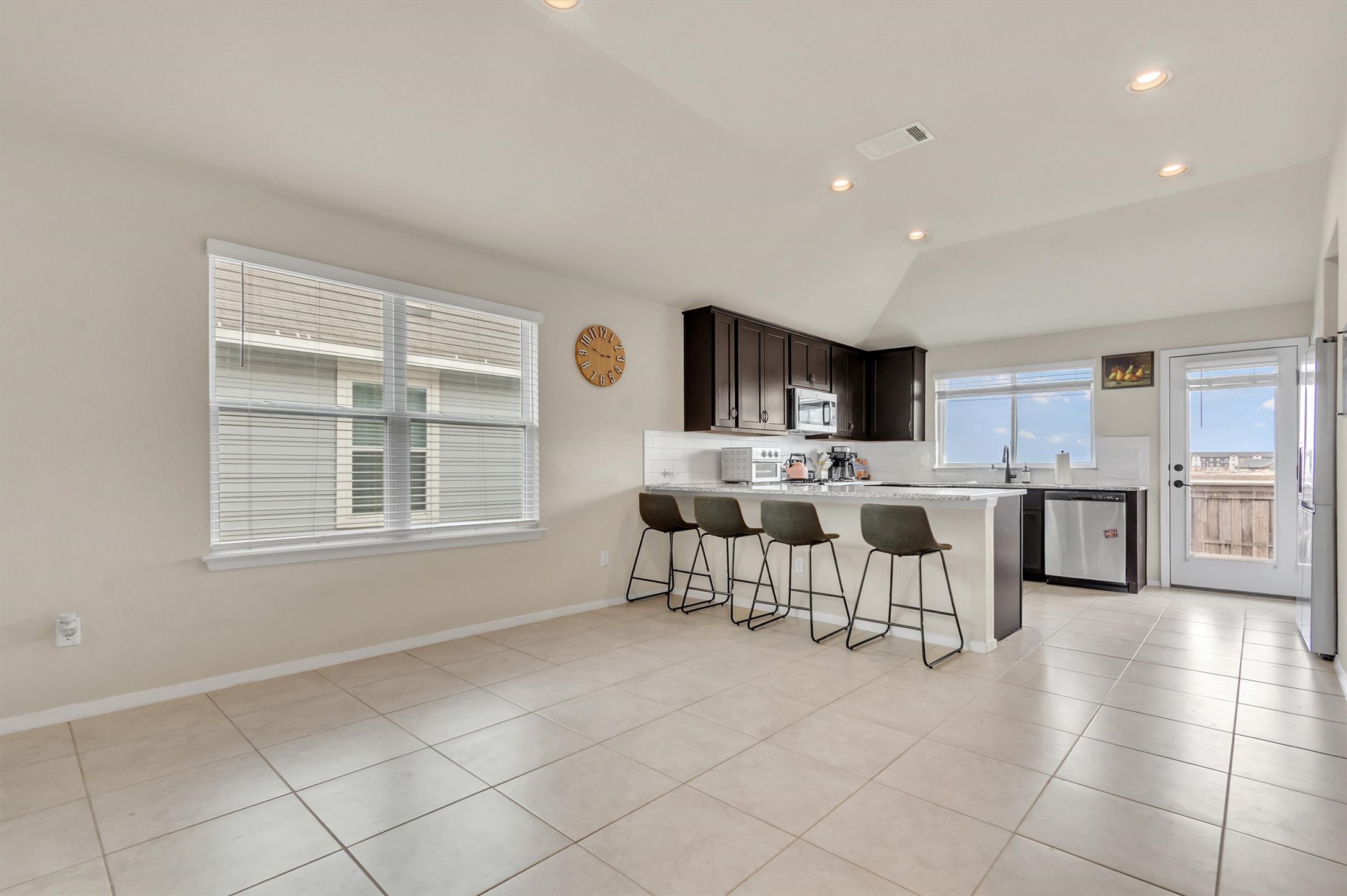 460 Delta Crest Maxwell, TX 78656 - Photo 7 of 18 Kitchen featuring a breakfast bar area, a peninsula, recessed lighting, lofted ceiling, and stainless steel appliances