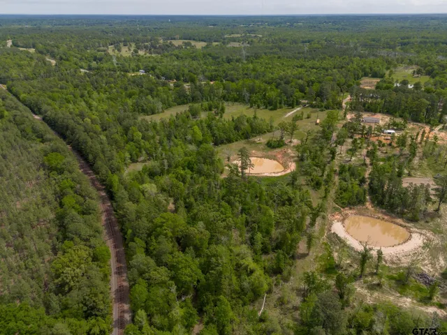 a view of a big room with a lake view and mountain view