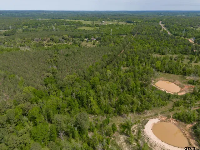 a view of a lake with a yard
