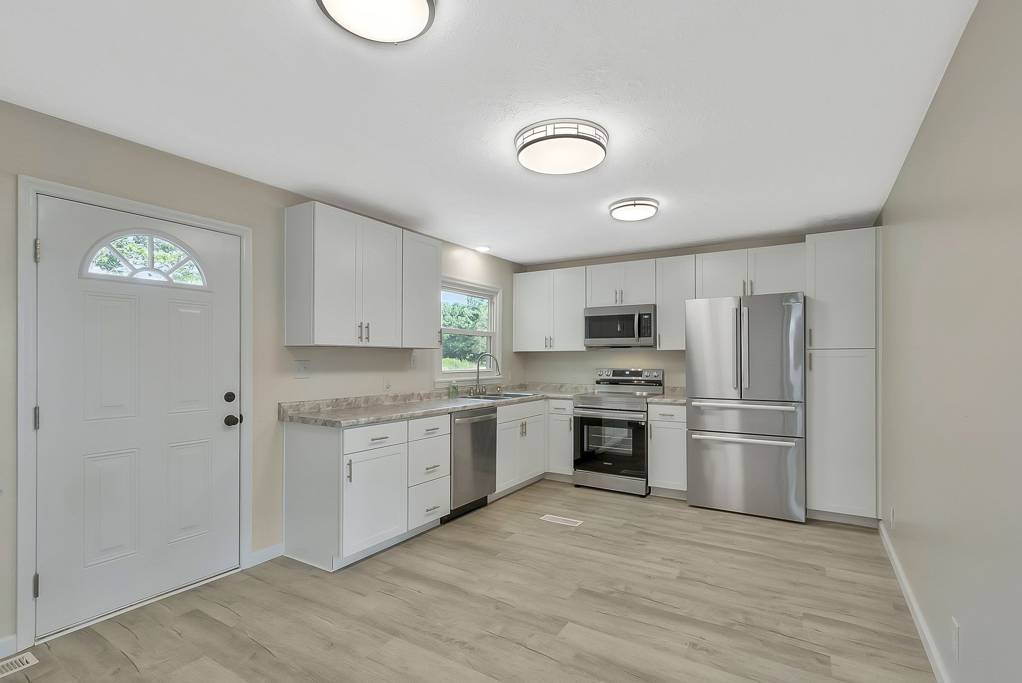 3289 Buffalo Road Ethridge, TN 38456 - Photo 17 of 45 a kitchen with a refrigerator sink and stove top oven