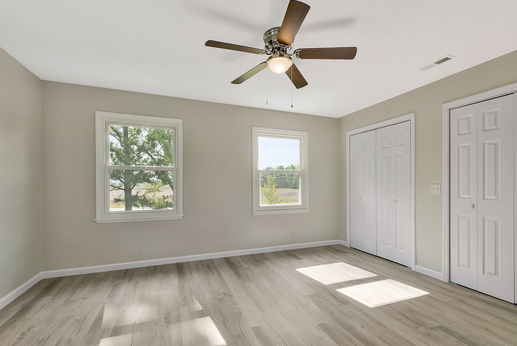 3289 Buffalo Road Ethridge, TN 38456 - Photo 26 of 45 a view of an empty room with wooden floor and a window