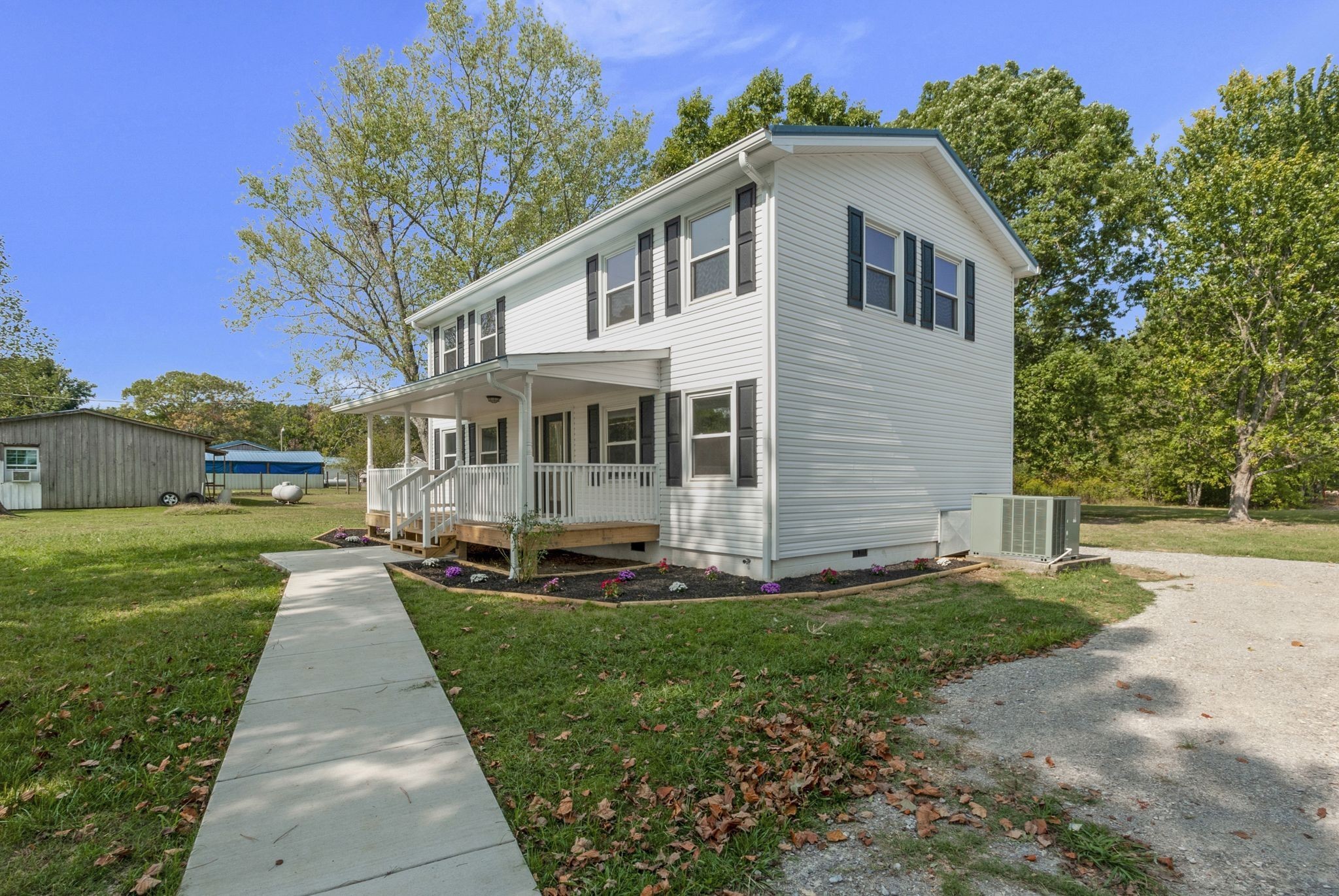 3289 Buffalo Road Ethridge, TN 38456 - Photo 8 of 45 a front view of a house with a yard