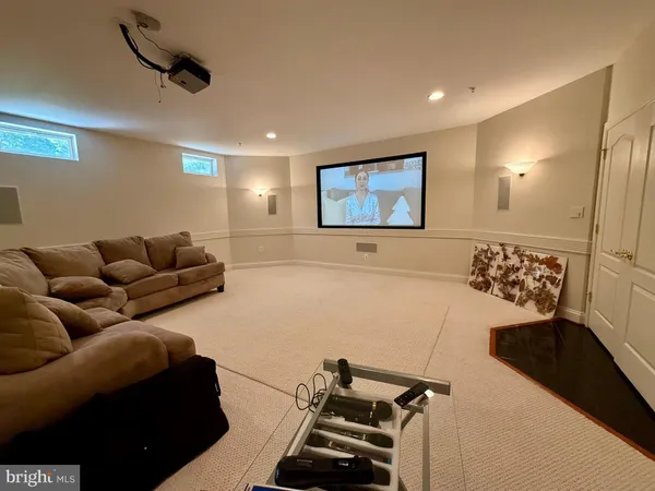 a view of a field of grass and trees