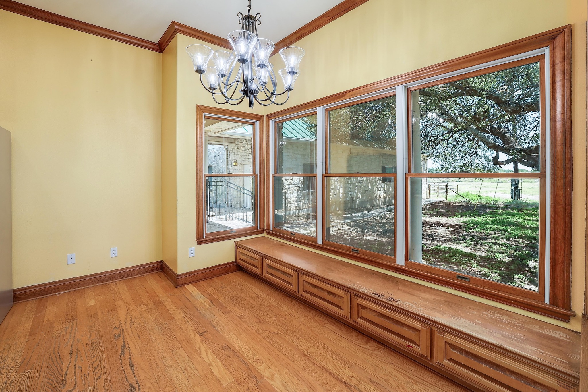 3900 Shell Road Georgetown, TX 78628 - Photo 9 of 40 Unfurnished dining area featuring crown molding, a chandelier, and light wood-style flooring