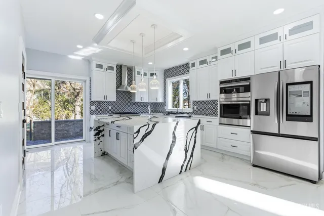 a view of living room and kitchen with fireplace