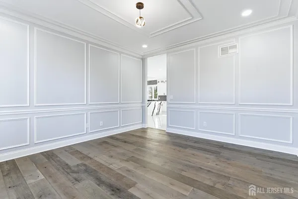 an empty room with wooden floor