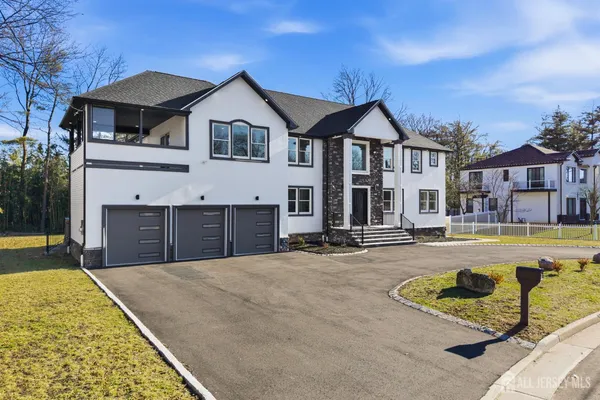 a front view of a house with swimming pool having outdoor seating