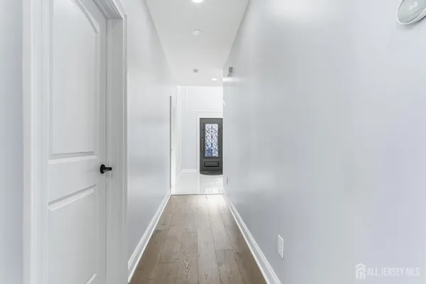 a bathroom with a granite countertop sink toilet and mirror
