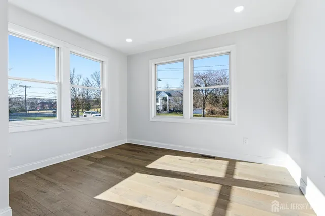 a view of an empty room with a large window