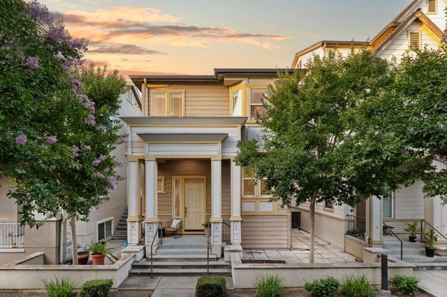 a front view of a house with trees