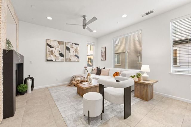a dining room with furniture a window and a chandelier