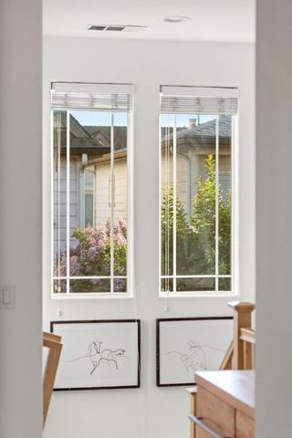 a view of a room with a large window