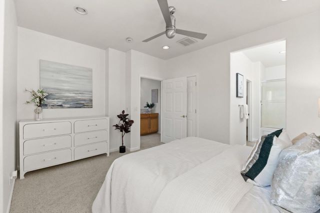 a bedroom with a bed and a dresser