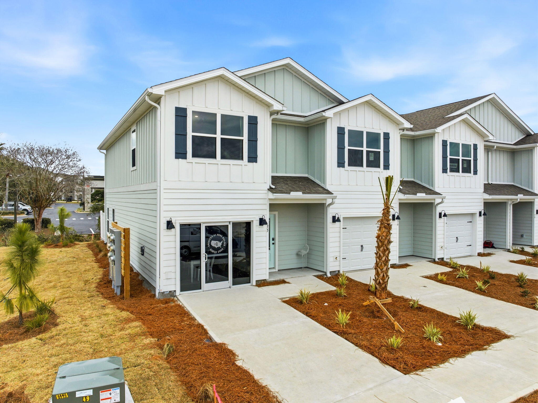 105 Foxtail Way, Unit 58 Destin, FL 32541 - Photo 1 of 21 a front view of a house with a yard