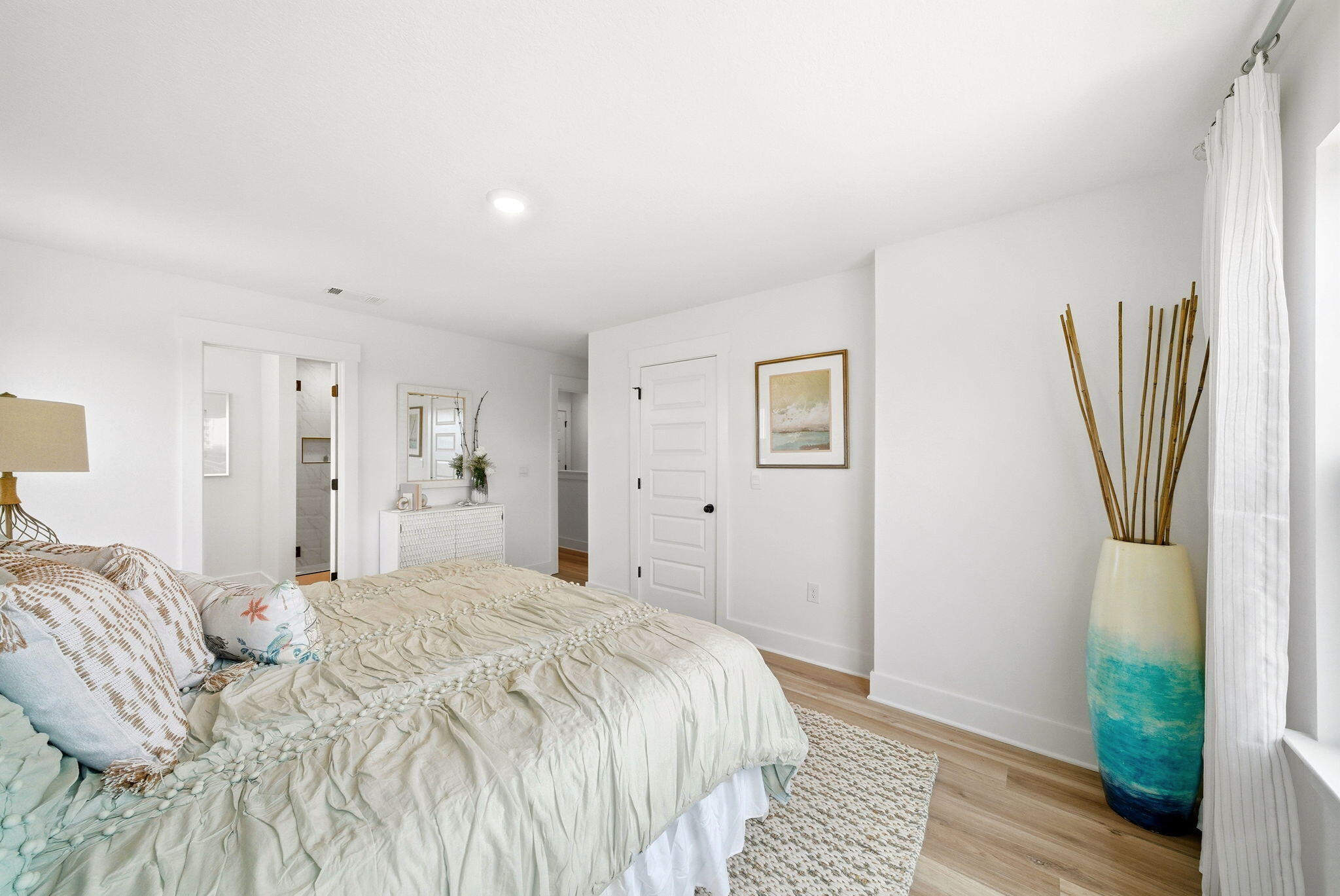 105 Foxtail Way, Unit 58 Destin, FL 32541 - Photo 15 of 21 a spacious bedroom with a bed and a wooden floor
