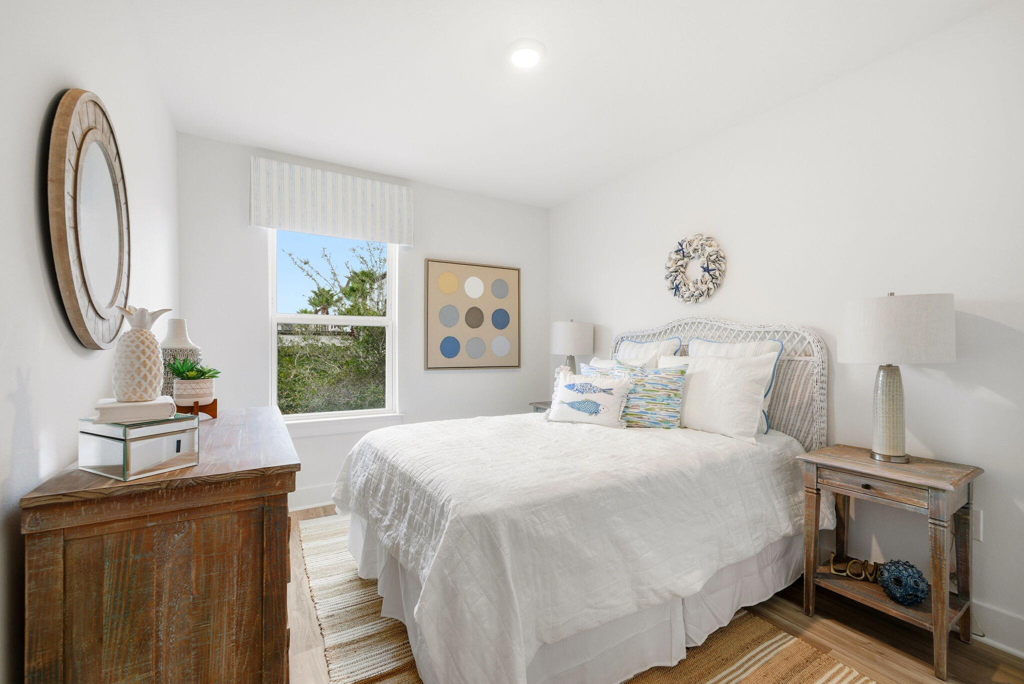105 Foxtail Way, Unit 58 Destin, FL 32541 - Photo 16 of 21 a bedroom with a bed a mirror and a window