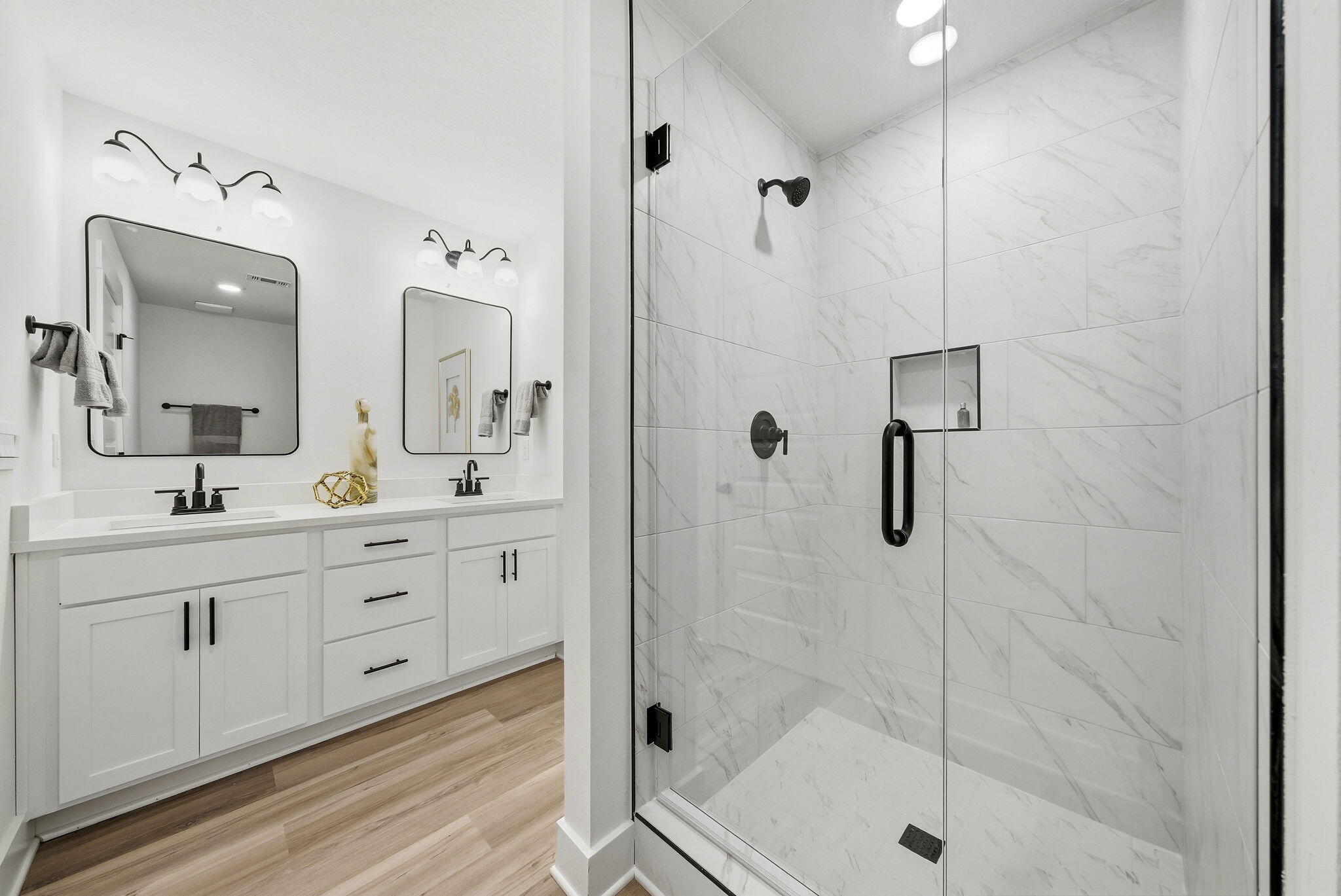 105 Foxtail Way, Unit 58 Destin, FL 32541 - Photo 19 of 21 a spacious bathroom with a shower sink and mirror