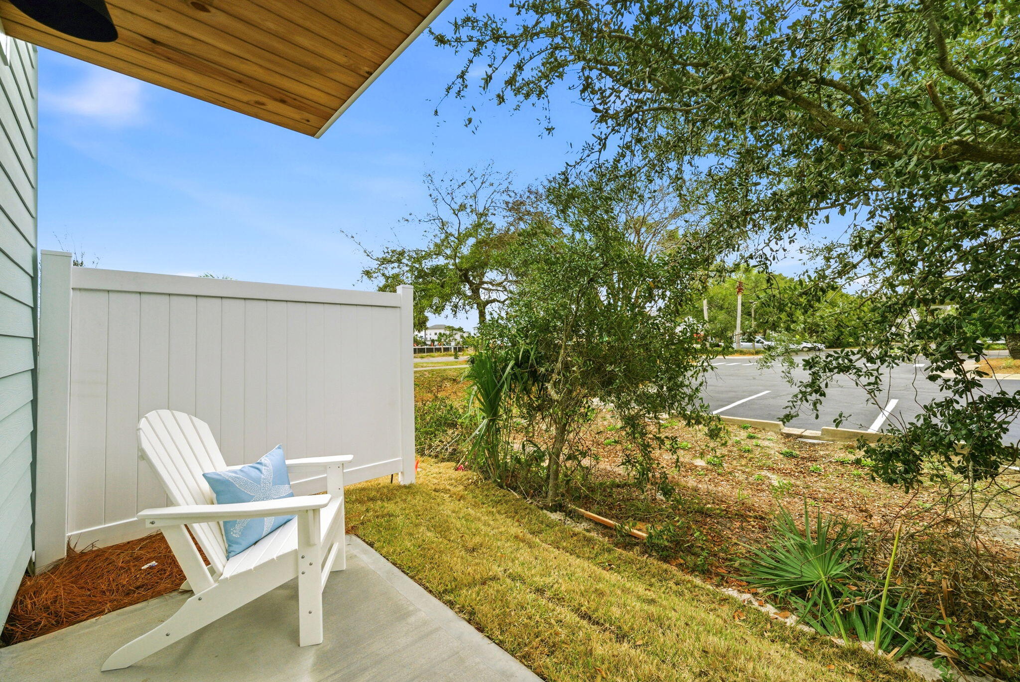 105 Foxtail Way, Unit 58 Destin, FL 32541 - Photo 20 of 21 a patio with table and chairs and potted plants