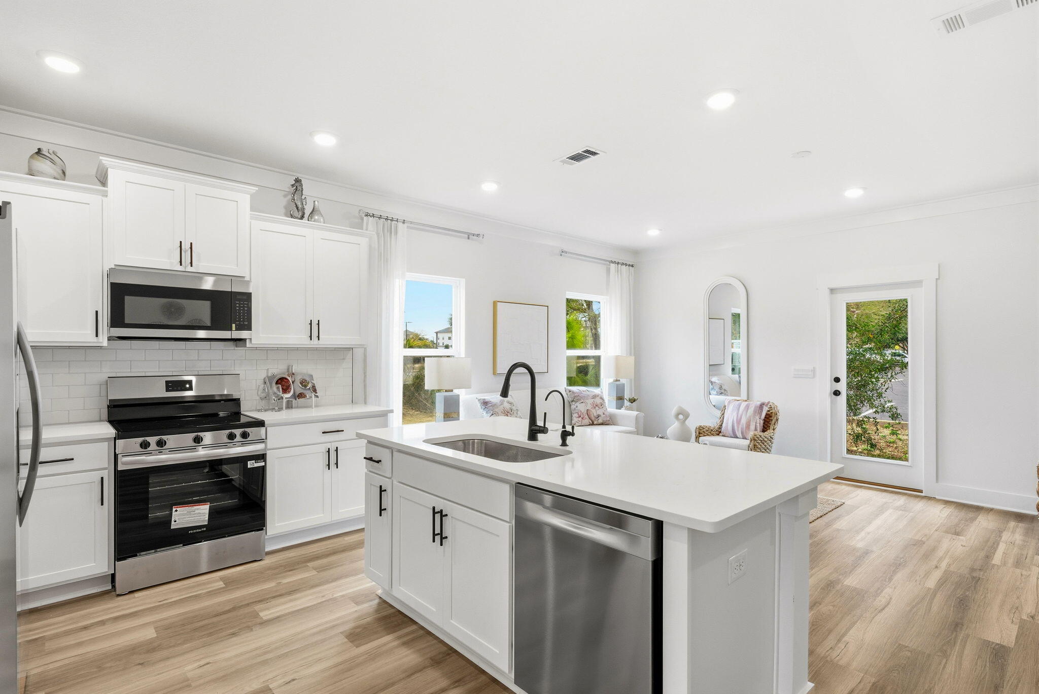 105 Foxtail Way, Unit 58 Destin, FL 32541 - Photo 4 of 21 a kitchen with stainless steel appliances granite countertop a sink stove and refrigerator