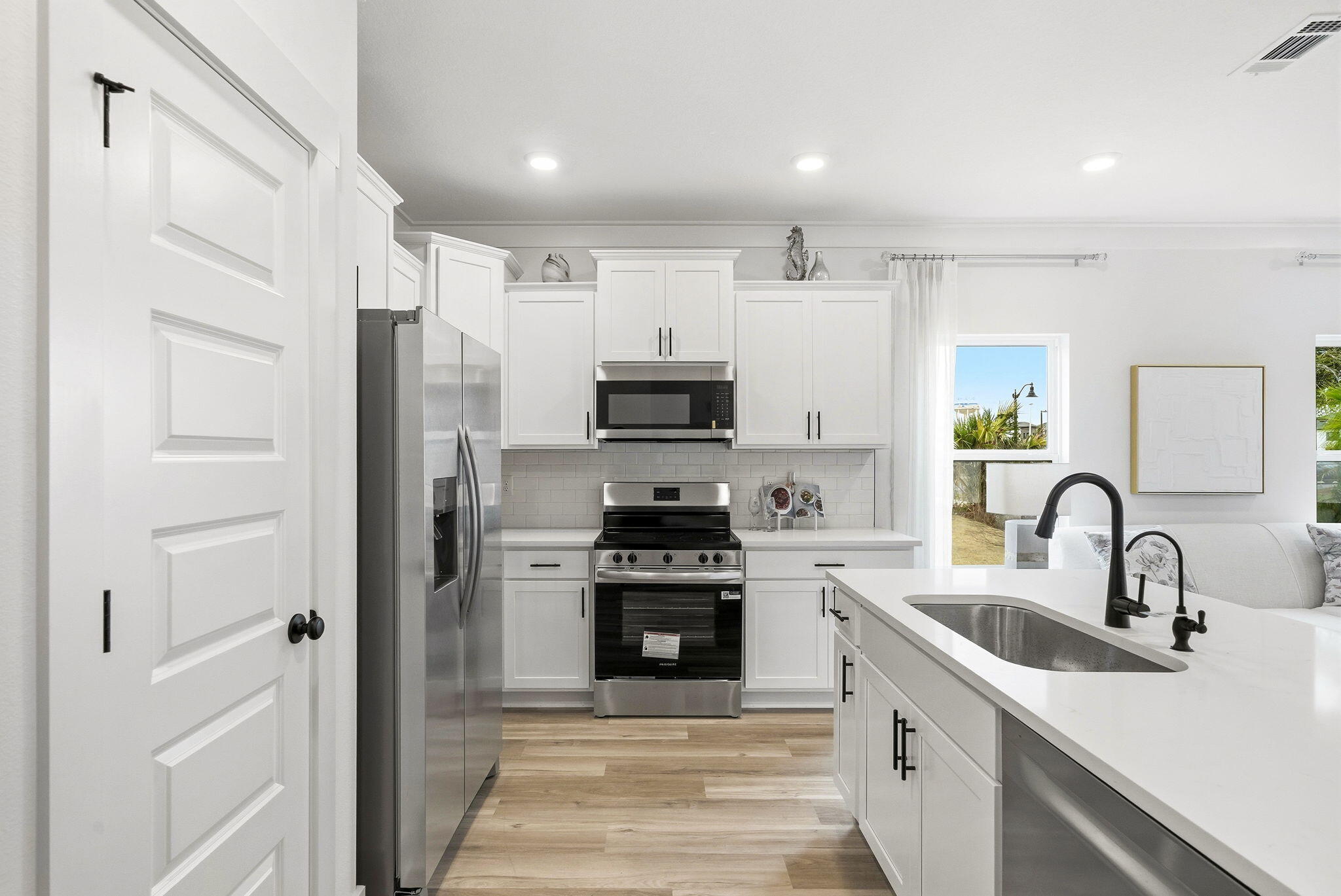 105 Foxtail Way, Unit 58 Destin, FL 32541 - Photo 5 of 21 a kitchen with refrigerator a stove and cabinets