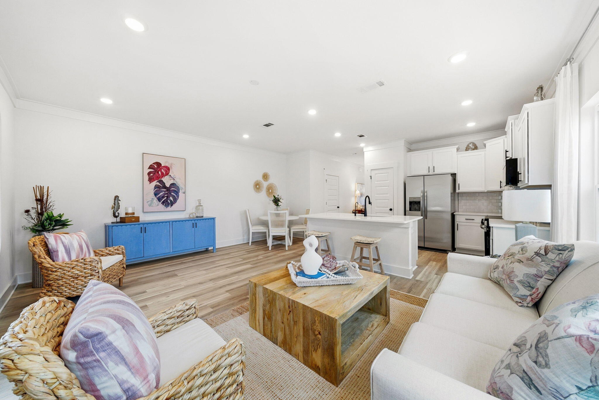 105 Foxtail Way, Unit 58 Destin, FL 32541 - Photo 8 of 21 a living room with kitchen island furniture and a kitchen view