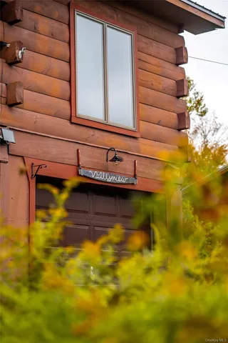a bedroom with furniture and a flat screen tv