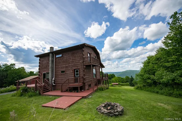a view of a balcony with wooden floor and a sink