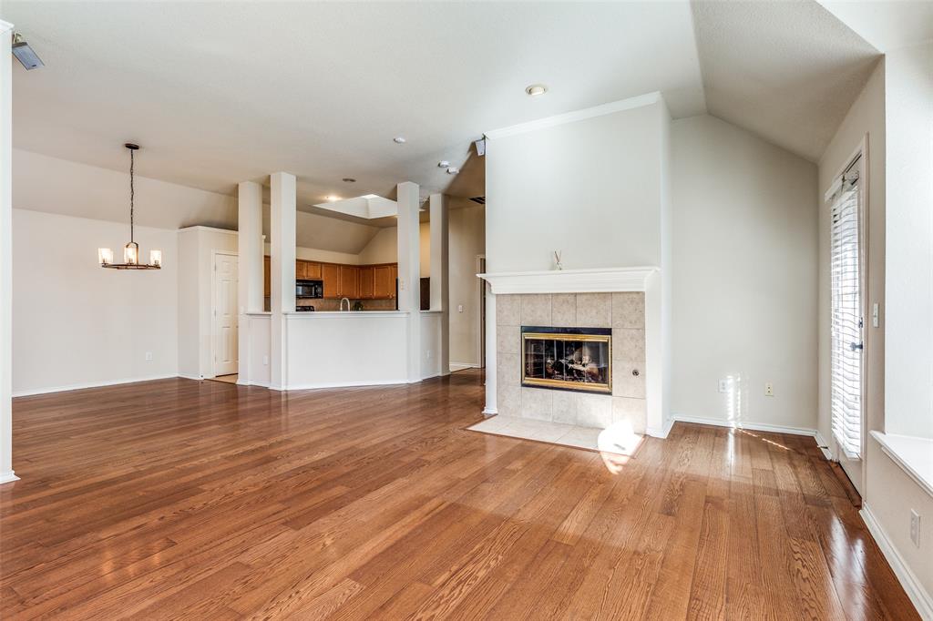 4527 Aspen Glen Road Plano, TX 75024 - Photo 2 of 13 With cozy fireplace and lots of natural light
