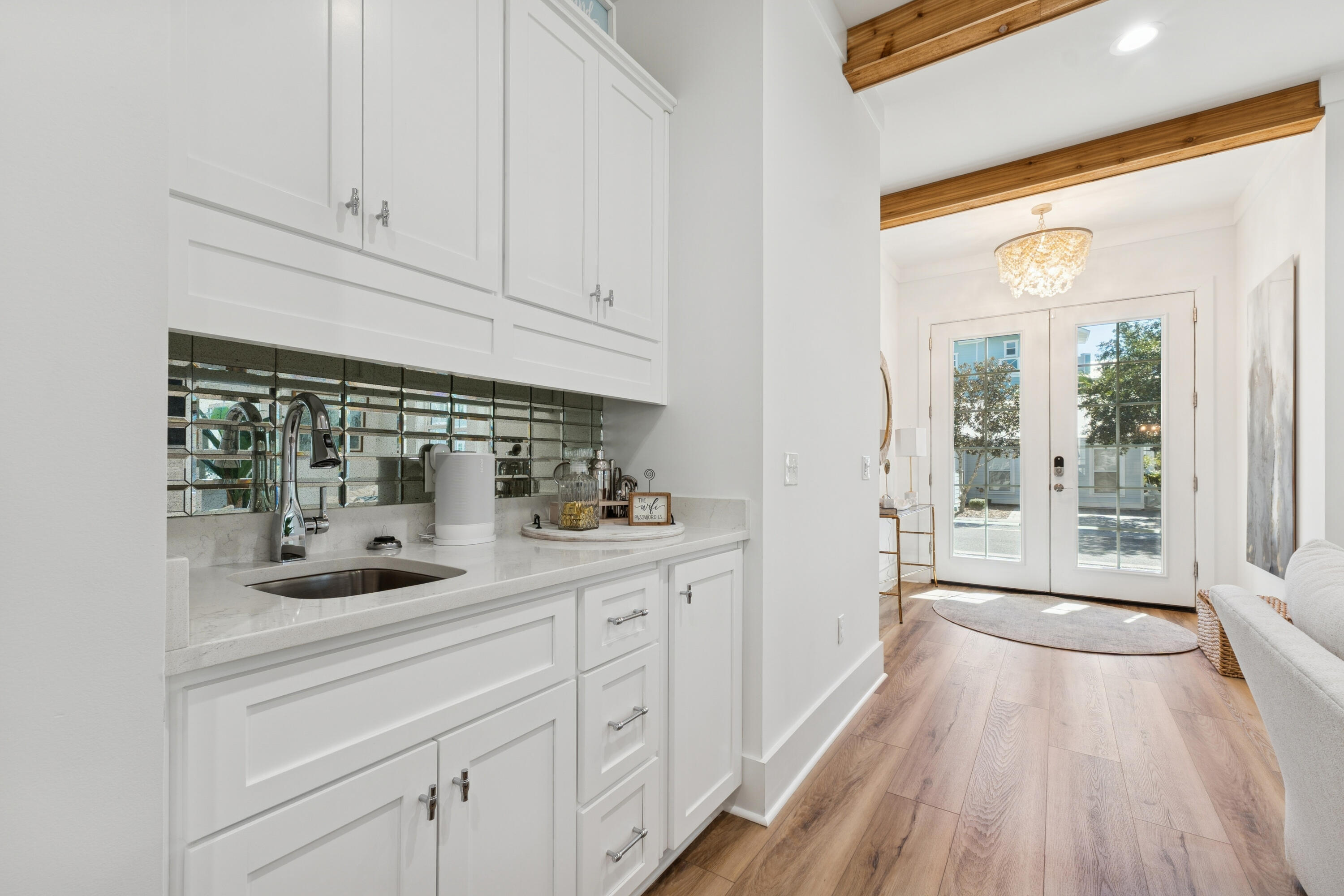 342 Beach Bike Way Inlet Beach Inlet Beach, FL 32461 - Photo 11 of 77 a kitchen with granite countertop a sink and cabinets with wooden floor
