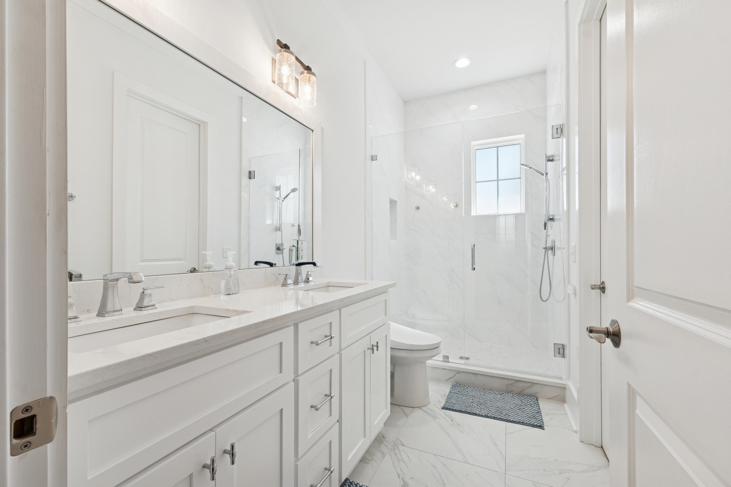 342 Beach Bike Way Inlet Beach Inlet Beach, FL 32461 - Photo 27 of 77 a bathroom with a double vanity sink toilet mirror and shower