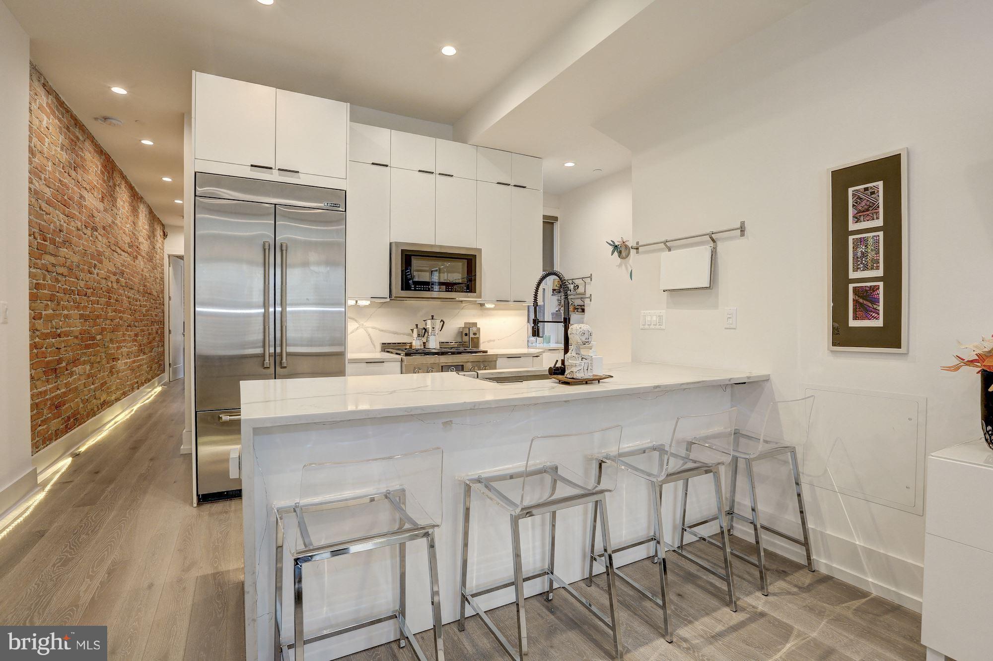 1817 Vernon Street Northwest, Unit 2 Washington, DC 20009 - Photo 5 of 24 Gorgeous exposed brick wall!