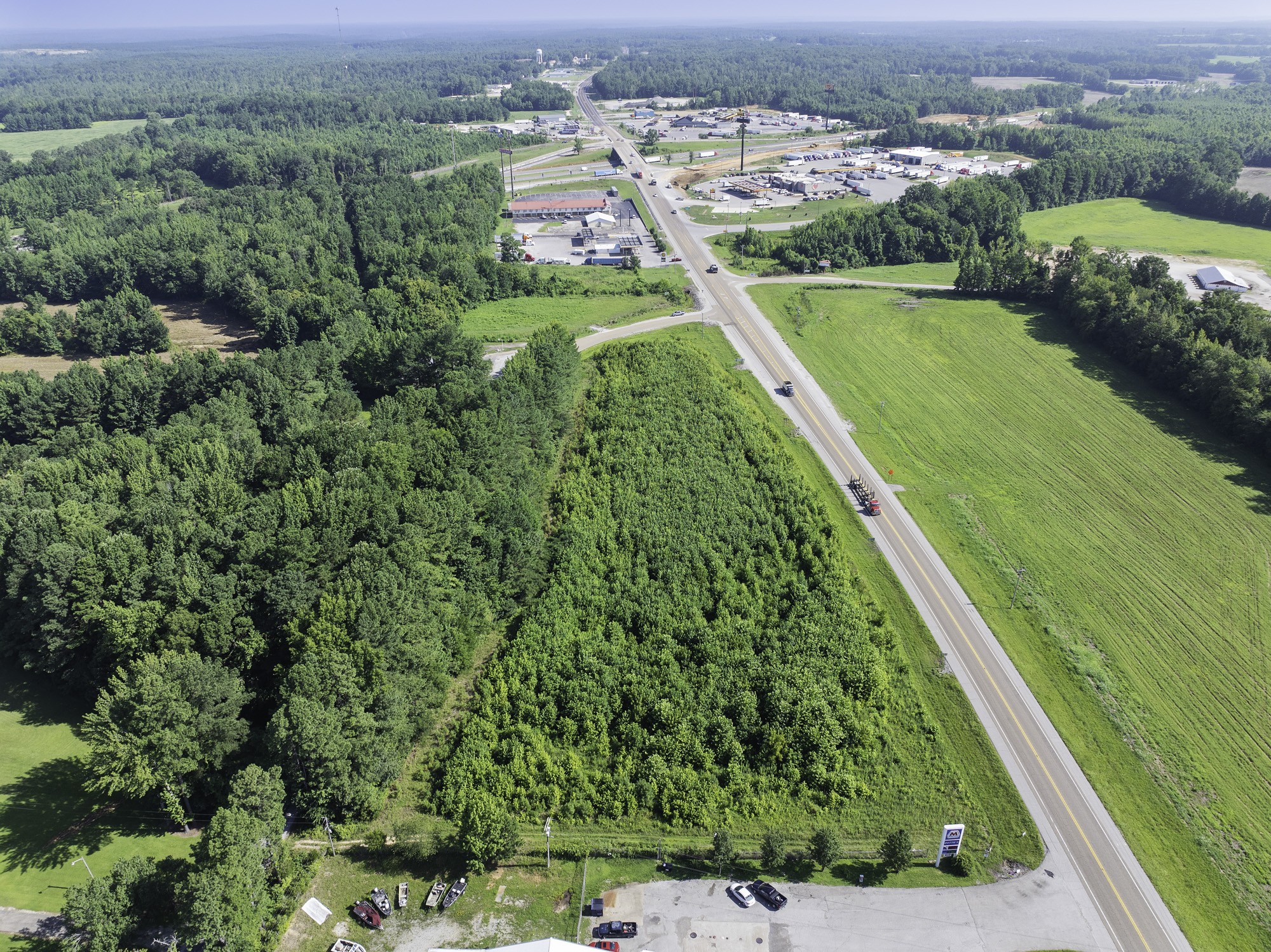 0 Spence Store Loop Holladay, TN 38341 - Photo 5 of 15 an aerial view of a house with a yard and lake view