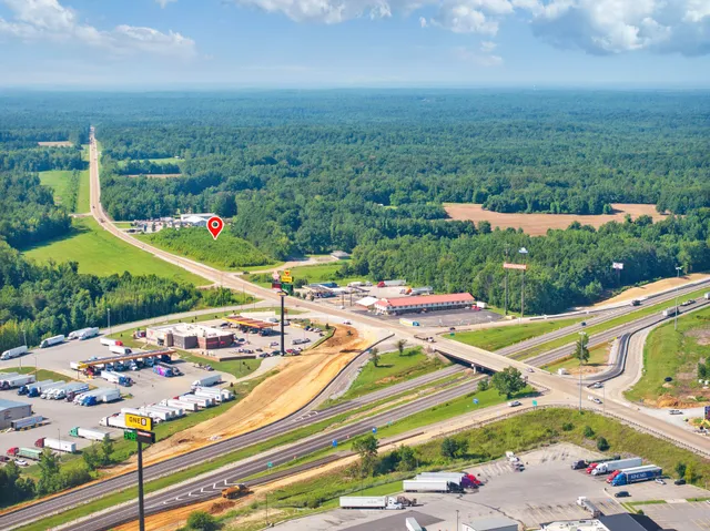 a view of a street with a yard