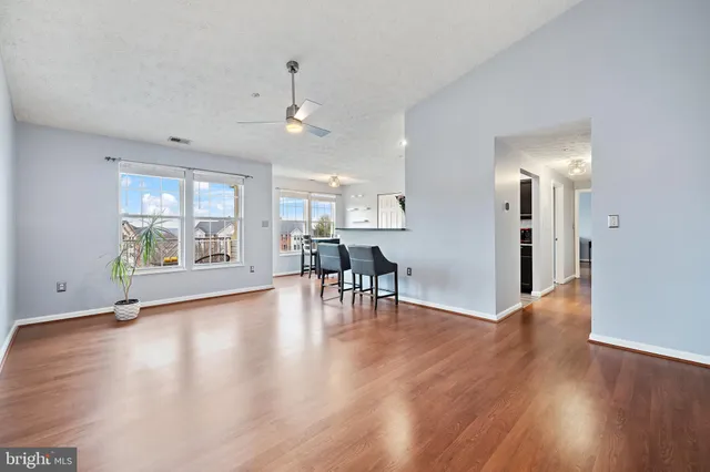 a view of a livingroom with furniture wooden floor and a rug