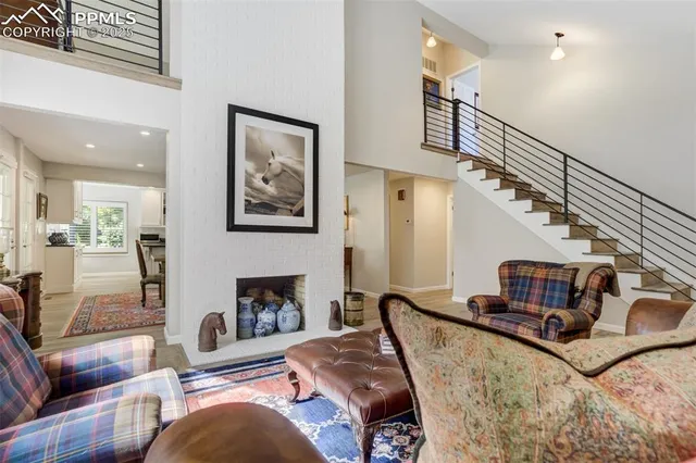 a living room with furniture fireplace and a flat screen tv