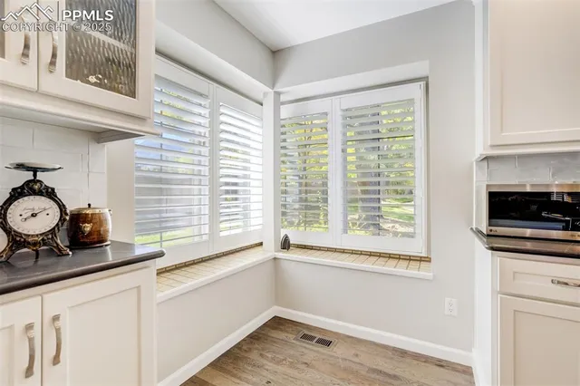 a bathroom with a sink and a window
