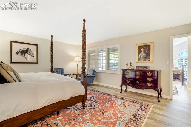 a bed room with a bed and a night stand