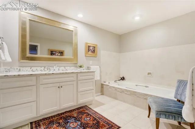 a bathroom with a bathtub and a sink