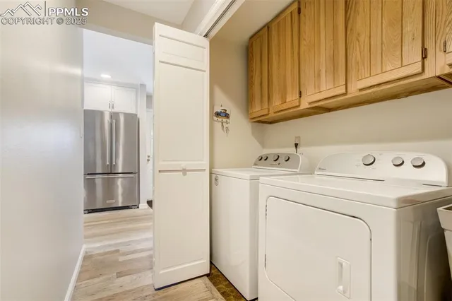 a bathroom with a granite countertop toilet sink and mirror