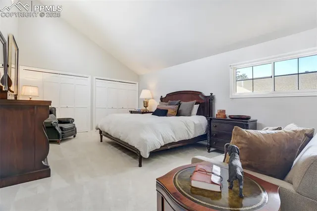 a bedroom with a bed and dresser