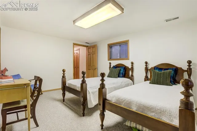 a view of a kitchen with fridge and rack