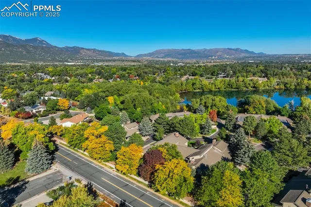 an aerial view of residential house and green space
