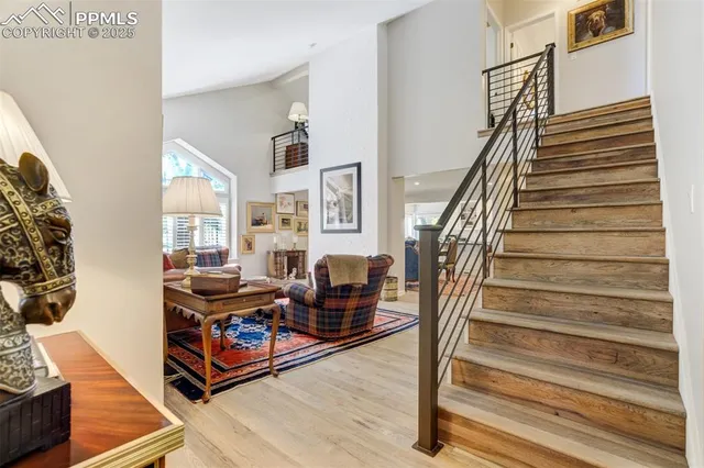 a living room with lots of furniture and a wooden floor