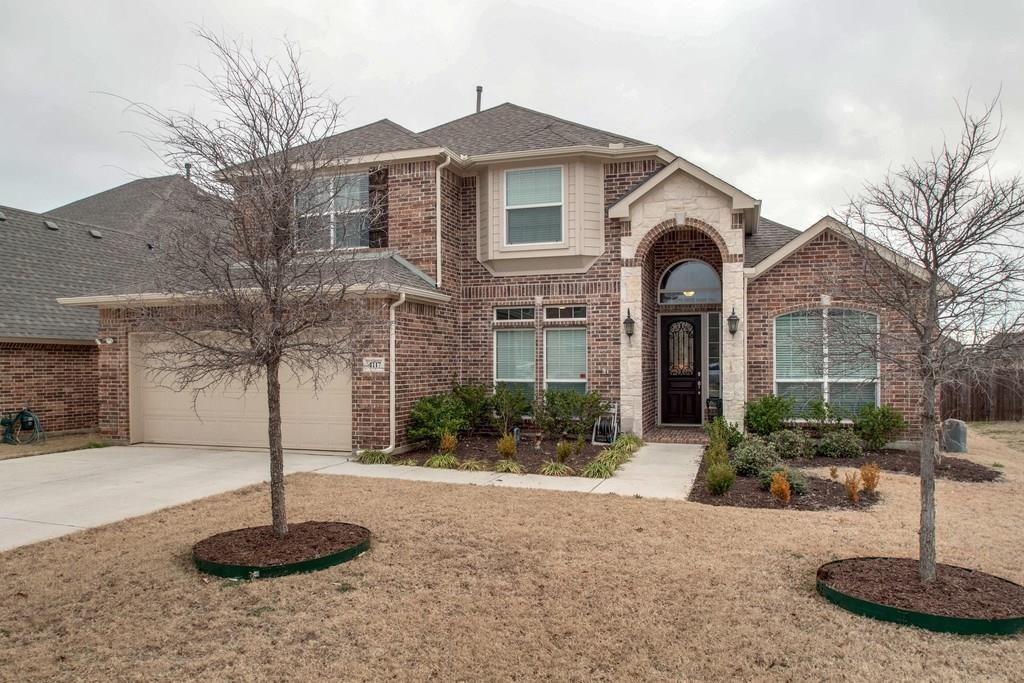 4117 Autumn Path Road Denton, TX 76208 - Photo 1 of 4 Brick and stone veneer exterior with an arched entryway