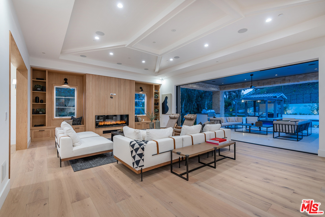 5716 Jed Smith Road Hidden Hills, CA 91302 - Photo 16 of 53 a living room with furniture and a large window