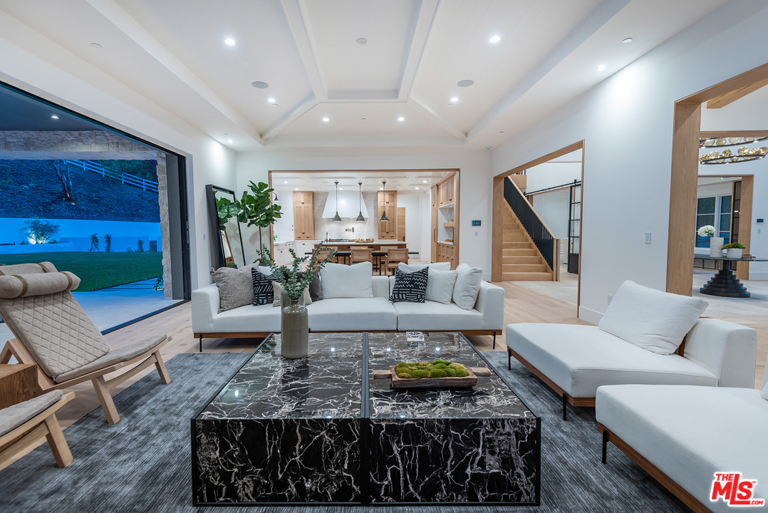 5716 Jed Smith Road Hidden Hills, CA 91302 - Photo 18 of 53 a living room with furniture and a potted plant