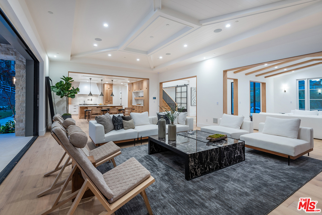 5716 Jed Smith Road Hidden Hills, CA 91302 - Photo 19 of 53 a living room with furniture rug and a large window