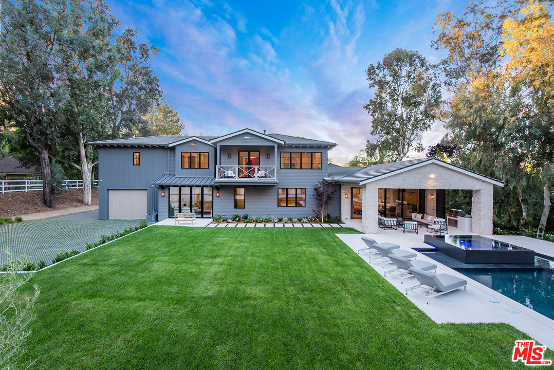 5716 Jed Smith Road Hidden Hills, CA 91302 - Photo 3 of 53 a front view of a house with garden