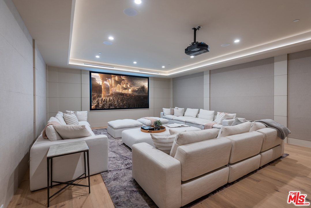 5716 Jed Smith Road Hidden Hills, CA 91302 - Photo 22 of 53 a living room with furniture and a flat screen tv